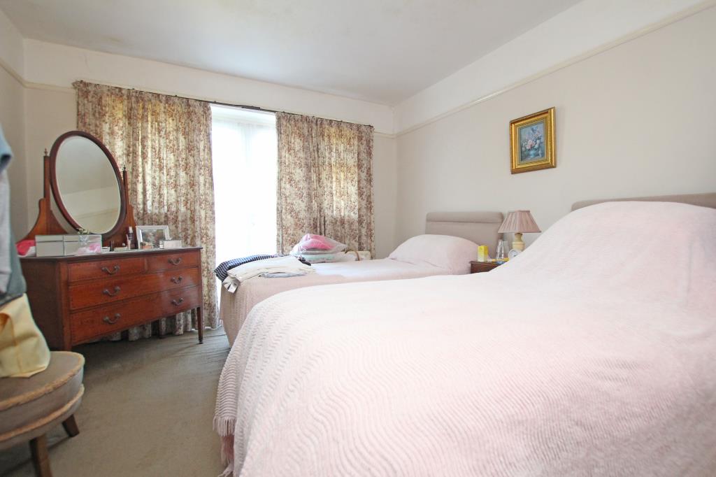 Lot: 129 - DETACHED BUNGALOW LET ON REGULATED TENANCY - Main bedroom with twin beds taken August 2024